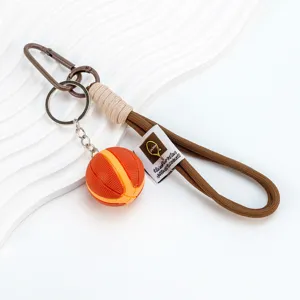 Basketball keychain with brown woven lanyard, creative two-tone sports bag pendant for gifts.