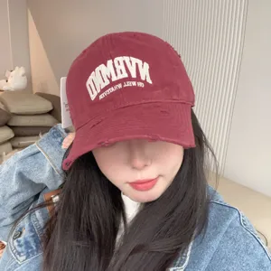 Distressed burgundy baseball cap for women, breathable soft top casual vintage hat detail.