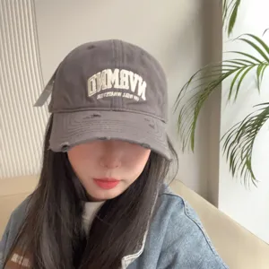 Distressed soft-top baseball cap for women, vintage washed casual cotton dad hat with embroidery.