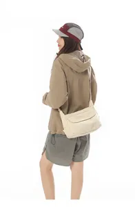 Casual canvas shoulder bag detail view, minimalist retro crossbody design for daily wear.