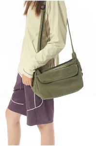 Retro canvas shoulder bag for women and men, casual crossbody bag with flap and pockets.