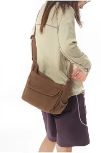 Retro canvas messenger bag detail shot, simple Japanese style brown crossbody bag for women.