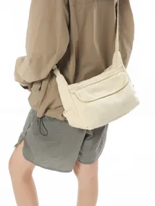 Casual solid color canvas shoulder crossbody bag for daily use and outdoor travel.