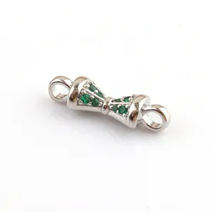 DIY silver metal jewelry connector accessory featuring green synthetic stones detail view