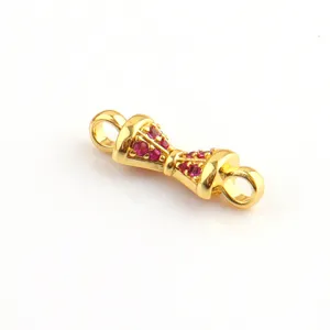 Exquisite gold plated DIY jewelry connector detail with red stones for custom bracelets.