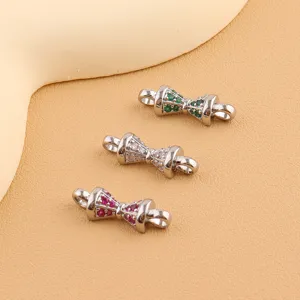 Detailed view of DIY jewelry connectors with sparkling cubic zirconia stones in stylish bow shape.