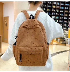 Sac a dos en velours cote avec motif etoiles et pois, ideal pour l'ecole et le voyage.