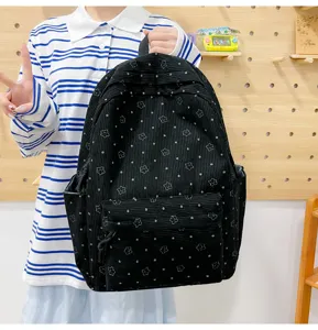 Sac à dos en velours côtelé noir avec motif d'étoiles, grand cartable pour étudiants et voyages.