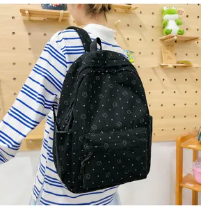 Sac à dos noir élégant en velours côtelé avec motif étoiles pour étudiants, école et voyages.