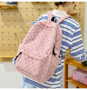 Sac à dos en velours côtelé rose avec motif d'étoiles, cartable décontracté et sac de voyage élégant.