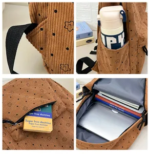 Sac à dos en velours côtelé grand sac d'école décontracté avec poches multifonctionnelles.