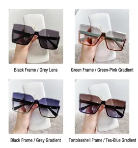 Détails de lunettes de soleil oversize sans monture avec verres dégradés élégants.