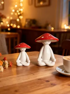 Closeup detail shot of the ceramic meditation mushroom figurines displayed in a warm cozy setting.
