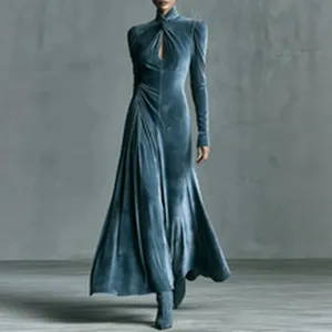 Elegant blue velvet maxi dress featuring long sleeves, mock neck, cutout, and flared skirt.