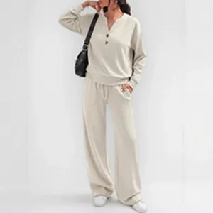 Detailed view of the casual beige long-sleeve top and wide-leg trousers lounge set.
