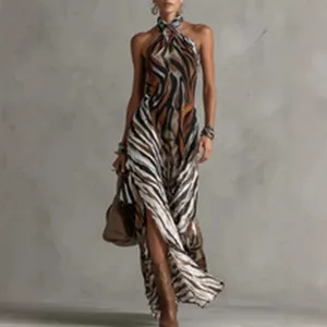 Elegant halter neck maxi dress with high slit and abstract animal print for women.