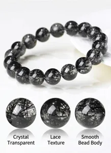 Natural black rutilated quartz beaded bracelet with clear crystal and delicate rutile needles.