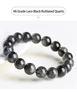 Close-up detail of natural lace black rutilated quartz round bead bracelet, exquisite texture.