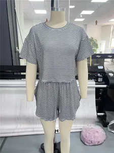 Detailed view of women black white striped knit pajama set short sleeve top and shorts.