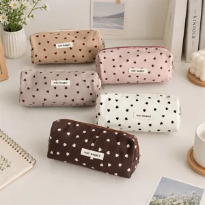 Canvas pencil case with cute heart print, large capacity zippered stationery pouch for students.