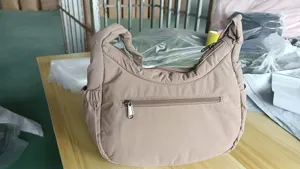 Casual nylon shoulder bag for women, lightweight hobo dumpling bag with zipper pockets, daily commuting.