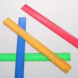 Close-up of colorful 30cm plastic rulers with double scale, showing metric and inch measurements.