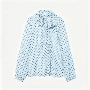 Light blue polka dot long sleeve blouse with a chic bow tie neck and loose fit for women.