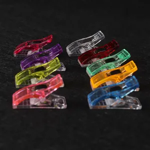Colorful transparent sewing clips, plastic craft wonder clips for quilting and holding fabric.