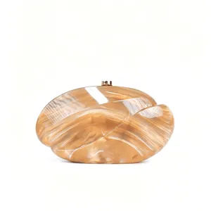 Acrylic wave clutch bag detail, stylish caramel marbled evening purse with metal clasp.