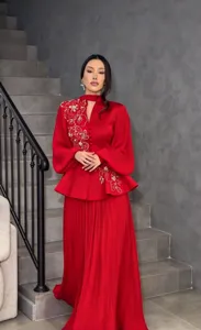 Elegant red two-piece set featuring long embroidered sleeves and a stylish pleated long skirt.