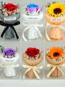 Detailed view of exquisite artificial flower bouquet gift boxes with transparent packaging.