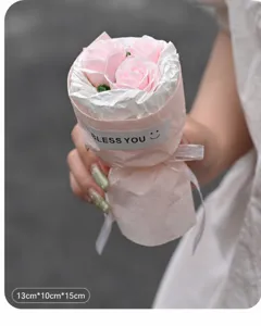 Detail shot of a mini pink rose bouquet gift box, elegant handmade floral arrangement.