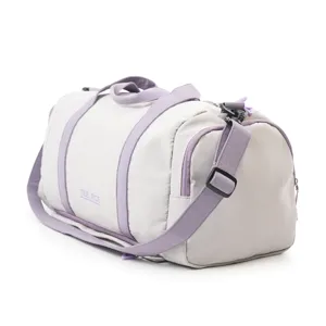 Stylish grey sports gym bag with purple straps, large capacity for travel and fitness use.