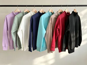 Detailed view of women's solid color mock neck loose sweatshirts hanging in multiple colors.