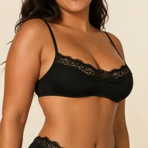 Close-up detail of the black wireless bra featuring delicate floral lace trim and soft fabric.