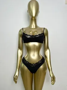 Detailed view of sexy French style black lace underwear set featuring wireless bra and trim.