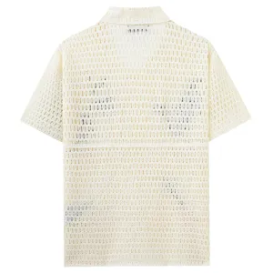 Detailed view of the back of a men's off-white hollow knit short-sleeve polo shirt.