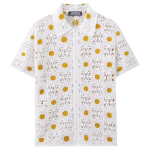 White crochet knit short sleeve shirt featuring intricate yellow daisy patterns for summer.