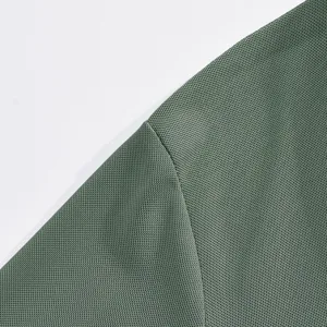 Close-up of dark green breathable mesh fabric detail, perfect for summer polo shirt.
