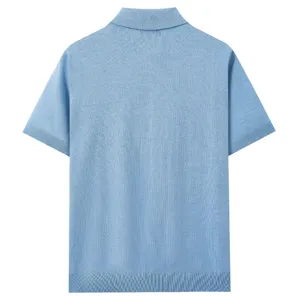 Back detail of a light blue short sleeve knit polo shirt featuring ribbed hem and cuffs.