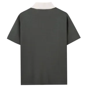 Men's dark grey knit polo shirt back detail showing contrast white collar and fine knit texture.