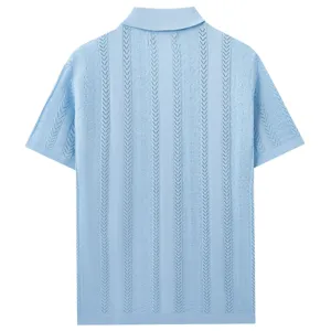Back detail of light blue knit polo shirt featuring vertical open-work jacquard pattern.