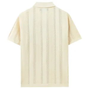 Back detail view of cream knitted short sleeve polo shirt with vertical hollow knit pattern.