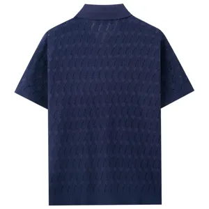 Detailed view of breathable men's hollow knit polo shirt fabric, dark blue short sleeve texture.