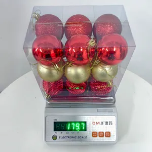 Christmas baubles set in transparent box, red and gold hanging ornaments for holiday tree.