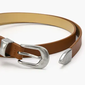 Elegant women brown leather belt with vintage silver buckle. Classic thin waist belt for daily wear.
