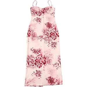 Detail shot of the pink and red abstract leopard print fabric on a stylish slip dress.