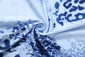 Detailed view of blue animal print fabric, showing soft texture and pattern close up.