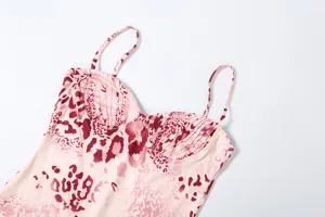 Close-up detail of the pleated bust and pink leopard print on women's stylish strap dress.