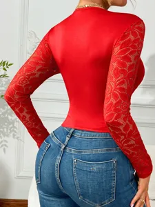 Women red long sleeve lace top paired with classic blue denim jeans for chic daily wear.